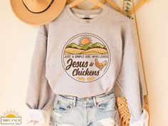 Jesus and Chickens. What more could a girl ask for? Wether you are buying this sweatshirt for yourself or as a gift for the chicken lover in your life, you won't be disappointed by the quality of this shirt. We print on Gildan brand sweatshirts which are both soft and cozy. Also available as a t-shirt or hoodie option. To view all our chicken shirt options please visit our shop's homepage. https://www.etsy.com/shop/AbbyZachDesigns ----HOW OUR SHIRTS ARE MADE ----  * We use the process of DTG, wh Brand Sweatshirts, Raising Cattle, Chicken Mom, Christian Shirts Designs, Chicken Shirt, Chicken Lady, Chicken Shirts, Lover Sweatshirt, Branded Sweatshirts