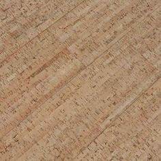 a man riding a skateboard on top of a wooden floor covered in lots of cork