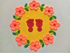 a cake decorated with flowers and two feet