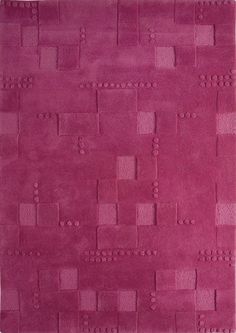 a purple rug with squares and dots on it