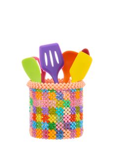 multicolored plastic utensils in a beaded container