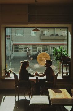 Couple sitting together at a coffee shop in Bern switzerland Coffee Shop Photo Shoot Couple, Couple At Coffee Shop Aesthetic, Cafe Shop Photography, Valentines Coffee Photography, Vintage Coffee Photography, Coffee Shop Cinematography, Couple Photoshoot In Cafe, Falling In Love At A Coffee Shop, Cafe Photography Ideas Coffee Shop