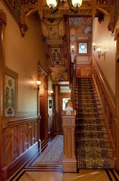 an ornate staircase leading up to the second floor