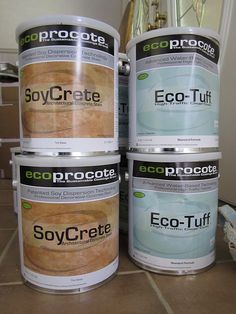 four buckets of eco - tuff paint sitting on the floor