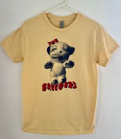 a yellow t - shirt with an image of a dog that says the bratts on it