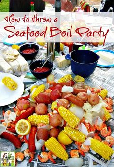 an outdoor seafood boil party with hot dogs and corn on the cob