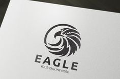 an eagle logo is shown on a white paper