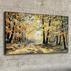 a painting on the wall of a forest with trees and leaves in fall colors,