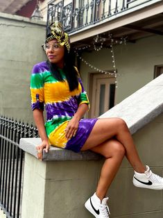 Look like royalty and stand out in the crowd with our Tie Dye Wave Adult Dress. Combining vibrant Mardi Gras colors with an alluring pattern, this dress is perfect for matching your Krewe and rocking the night away! Mardi Gras Colors, Adult Dress, Feather Mask, New Orleans Mardi Gras, Beaded Hat, Polo Shirt Dress, Mardi Gras Beads, Tie And Dye, Night Shirt