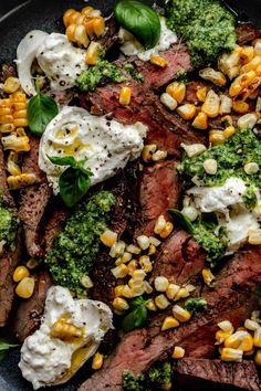 steak, corn and broccoli on a plate with sour cream in the middle