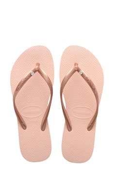 A sparkling crystal adorns the strap of this casual flip-flop that goes from beach to brunch with comfort and ease. Style Name:Havaianas Slim Crystal Flip Flop (Women). Style Number: 6113045. Pool Shoes, Pink Flip Flops, Rubber Flip Flops, Havaianas Flip Flops, Beach Flip Flops, Flip Flop Shoes, Girls Sandals, Helly Hansen, Strap Tops