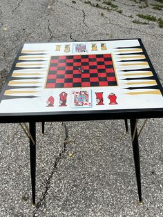 a table with chess pieces painted on it