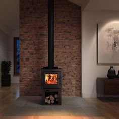 a wood burning stove sitting inside of a living room next to a painting on the wall