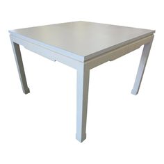 a white table with two legs and a square top