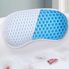 a close up of a memory pillow in the bathtub filled with foam and water