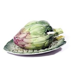 an artichoke is sitting on a plate