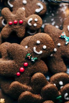 several gingerbread cookies with decorations on them