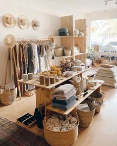 a room filled with lots of clothes and baskets