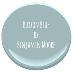 a white button with the words buxton blue by benjamin moore