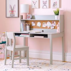 a well dressed desk with chairs and pictures on the wall above it, along with an advertisement for martha stewart living and learning kids'desk