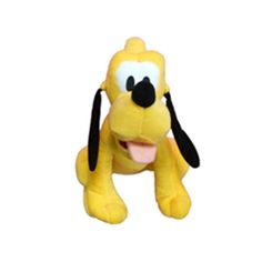 a yellow stuffed dog with black ears and tongue on it's head, sitting in front of a white background