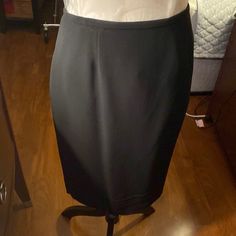 Dana Buchman Skirt. Size 8. The Skirt Was Never Worn And Is Not Hemmed. This Is A Very Expensive Skirt As You Can See The Tag Is Attached With A Price Of $168.00. There Is A Kick Pleat In The Back. Nice. Fitting Skirt. Elegant Knee-length Solid Skort, Formal Mini Skirt With Relaxed Fit And Lining, Elegant Pencil Skirt Skort With Lined Skirt, Elegant Pencil Skort With Lined Skirt, Elegant Black Pencil Skirt Shaped Skort, Formal Fitted Skirted Skort, Fitted Skirted Skort For Formal Occasions, Formal Stretch Mini Skirt, Elegant Midi Skort For Workwear