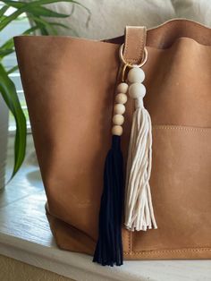 a brown bag with a tassel hanging from it