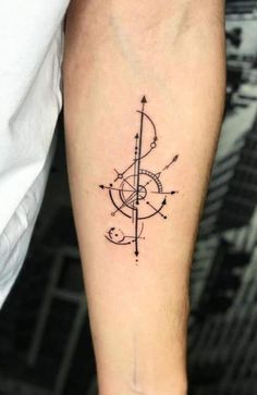 a black and white photo of a tattoo on the arm with an arrow in it