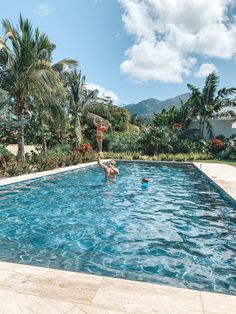 two people are playing in the swimming pool