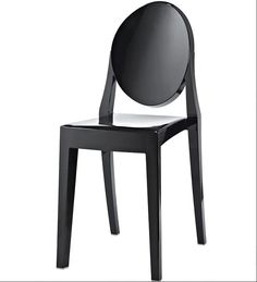 a black and white chair with a mirror on it