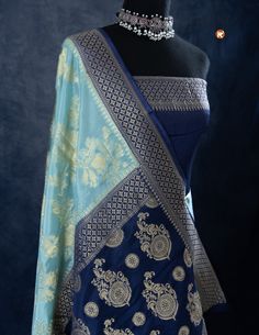 Indulge in luxury with our Sky Blue Khaddi Silk saree, adorned with delicate Golden Jaal work. Featuring a lightweight and airy fabric, this saree offers both comfort and elegance. Elevate your style with this beautiful saree and leave a lasting impression on any occasion! Luxury Blue Katan Silk Dupatta, Luxury Royal Blue Banarasi Silk Dupatta, Blue Tissue Silk Pre-draped Saree For Designer Wear, Blue Tissue Silk Pre-draped Designer Saree, Designer Blue Tissue Silk Pre-draped Saree, Blue Tissue Silk Sharara For Navratri, Elegant Blue Anarkali Set With Cutdana, Blue Pre-draped Saree With Unstitched Blouse In Tissue Silk, Blue Dola Silk Pre-draped Saree With Pallu