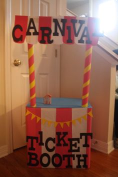 a carnival ticket booth sitting on the floor