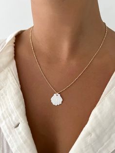 Mother of pearl shell pendant on a dainty gold-filled figaro chain! Beautiful pop of white for the summer time. White Shell-shaped Jewelry With Pearl Pendant, White Shell-shaped Pearl Pendant Jewelry, White Shell Charm Necklace Gift, White Shell-shaped Necklace, White Shell Necklace With Pearl Pendant, White Shell Necklace With Clavicle Chain, White Shell Charm Necklace As Gift, White Shell Charm Necklace For Gift, Dainty White Shell-shaped Necklace