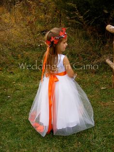 "WEDDINGS IN CAMO.com FALL flower girl dress.Leaves or flowers inside tulle skirt with colored satin sash. EXAMPLES Shown in DUCK BLIND Camo top with chocolate brown sash and ivory skirt OR white with orange sash and leaves OR MC2 PURPLE with Ivory. Hemline is floor length. NOTE--Leaves can be substituted with flowers. Make a note when you order for your colors Many colors are available. Contact us early so we can match your wedding colors. This listing has some of the most popular color options Fall Flower Girl, Fall Flower Girl Dresses, Country Flower Girls, Flower Girl Dresses Country, Harvest Wedding, Wedding October, Halloween Themed Wedding, Boda Mexicana, Outdoor Fall Wedding