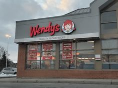 a wendy's restaurant is shown in the evening