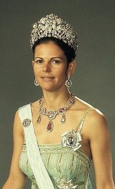 a woman wearing a tiara and dress