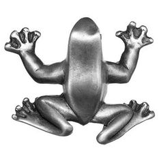 a metal frog figurine sitting on top of it's back legs and arms