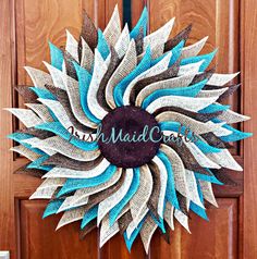 a blue and white wreath with the words march on it hanging from a wooden door