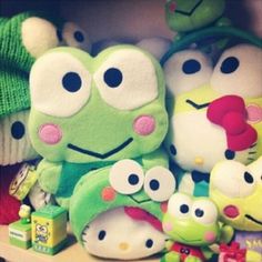 many stuffed animals are sitting on a shelf