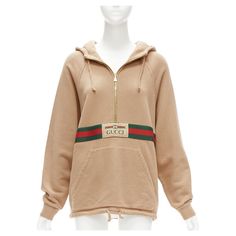 GUCCI Alessandro Michele beige cotton half zip vintage logo pullover XS Reference: LNKO/A02246 Brand: Gucci Designer: Alessandro Michele Model: 644656 XJC3W 2603 Material: Cotton Color: Beige, Multicolour Pattern: Striped Closure: Half Zip Lining: Beige Fabric Extra Details: Reminiscent of a vintage tracksuit, this hooded sweatshirt features a front zip detail and contrast red piping. Emblematic House codes, like the green and red Web stripe and the Gucci jacquard label, enrich the design. Made Gucci Alessandro Michele, Gucci Tracksuit, Vintage Tracksuit, Zip Lining, Red Web, Gucci Brand, Mario Testino, Gucci Outfits, Gucci Designer