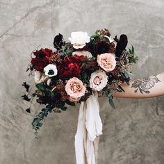 a person holding a bouquet of flowers in their hand with an instagram message below