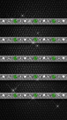 four rows of black leather with green and white diamonds on them, all lined up in the same row