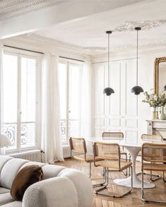 a living room filled with furniture and white walls