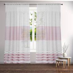 pink and white striped curtains hanging on a wall in front of a window with a potted plant