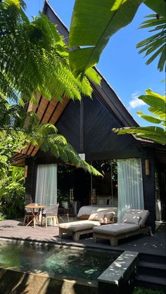 an outdoor living area next to a pool