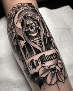 a black and white tattoo with a skeleton on it's arm that says la muerte