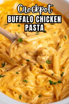 a close up of a bowl of chicken pasta with a wooden spoon in it and the words, crockpot buffalo chicken pasta