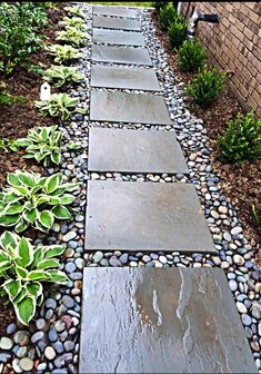 a walkway made out of stones and gravel