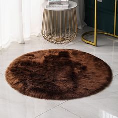 a round brown rug sitting on top of a white tile floor next to a table