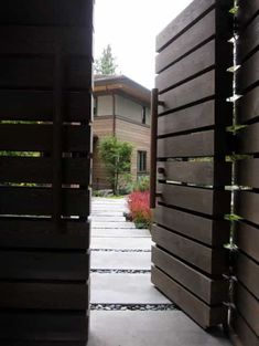 an open wooden door leading to a house